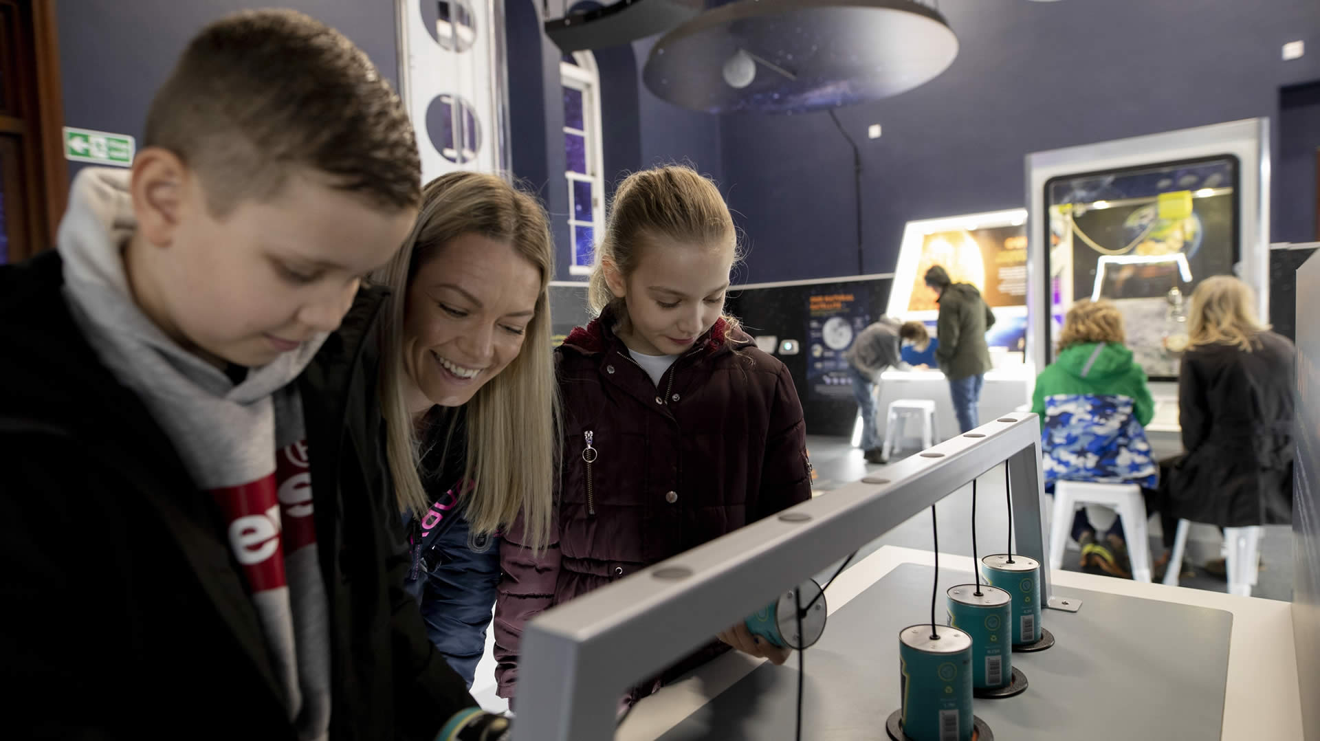 Visitors inside Kirkcudbright Dark Space Planetarium